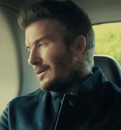 Bearded Man Sitting In Car Looking Out Window GIF