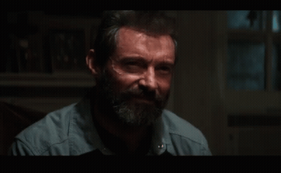 Bearded Man Sitting In Dark Room GIF