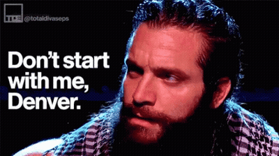 Bearded Man Sitting In Front Of Don't Start With Me Denver Sign GIF