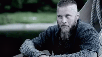 Bearded Man Sitting On Boat Arms Crossed GIF