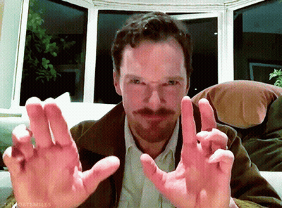 Bearded Man Sitting On Couch Hands Outstretched GIF