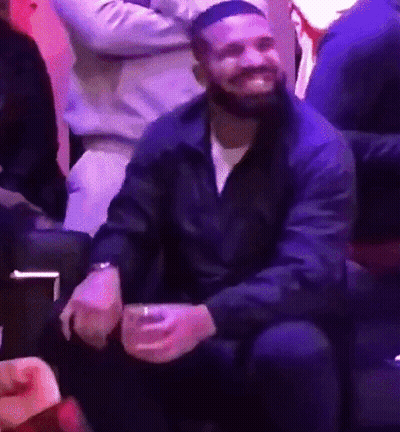 Bearded Man Sitting On Couch Holding Beer GIF
