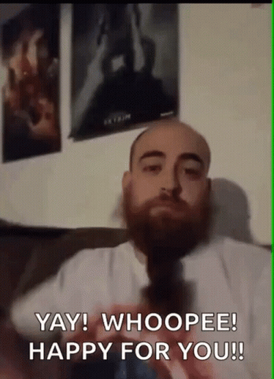 Bearded Man Sitting On Couch Says Yay Whoopee Happy For You GIF