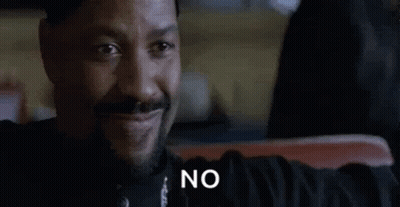 Bearded Man Sitting Smiling Saying No GIF