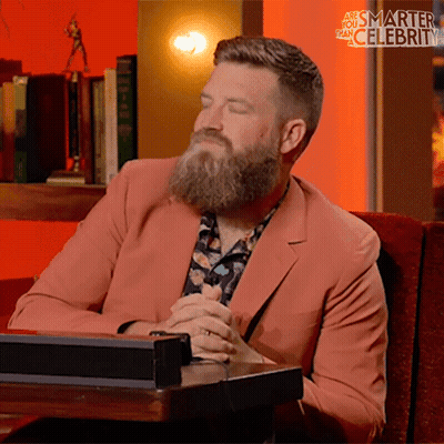 Bearded Man Sitting With Eyes Closed Smarter Than Celebrity GIF