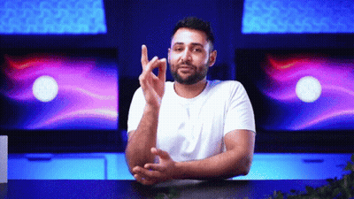 Bearded Man Sitting With Folded Hands Making Gesture GIF