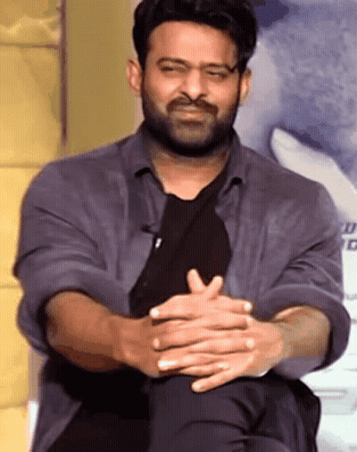 Bearded Man Sitting With Folded Hands GIF