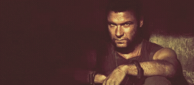 Bearded Man Sitting With Hands On Knees GIF