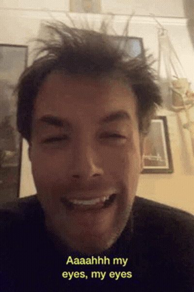 Bearded Man Smiling And Making Funny Face GIF