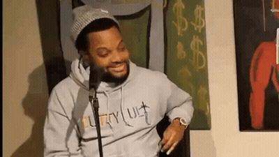 Bearded Man Smiling At Microphone GIF