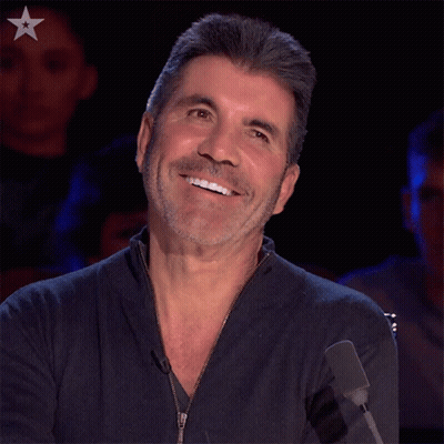 Bearded Man Smiling At Microphone With Star GIF