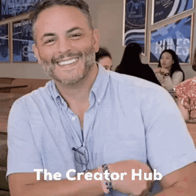 Bearded Man Smiling At Table GIF