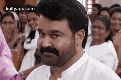 Bearded Man Smiling Before Crowd GIF