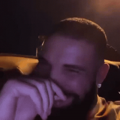 Bearded Man Smiling Eyes Closed in Car