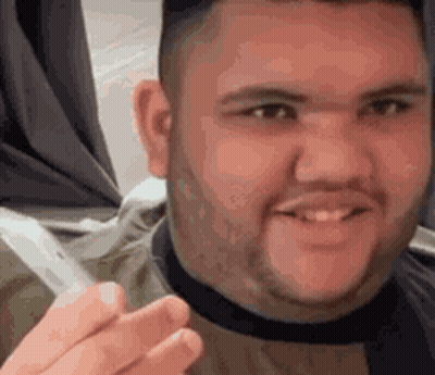Bearded Man Smiling Holding Cigarette GIF