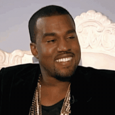 Bearded Man Smiling In Black Jacket And Gold Chains GIF