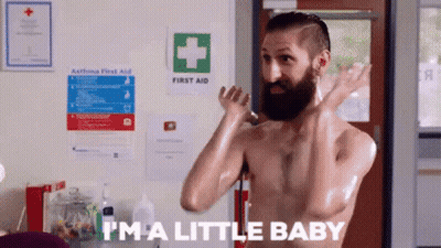 Bearded Man Smiling In Black Vest GIF
