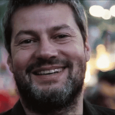 Bearded Man Smiling In Blurry Photo GIF