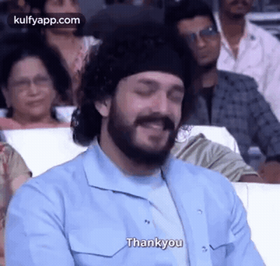 Bearded Man Smiling In Crowd GIF