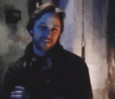 Bearded Man Smiling In Dark Blurry Photo GIF
