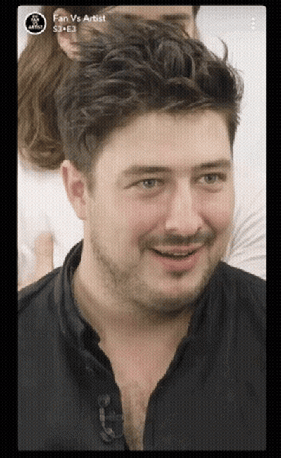 Bearded Man Smiling In Fan Vs Artist Ad GIF