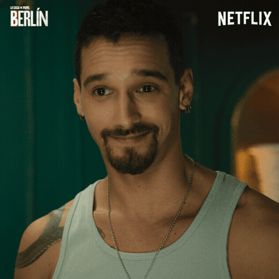 Bearded Man Smiling In Front Of Berlin Poster GIF
