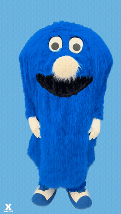 Bearded Man Smiling In Front Of Crowd GIF