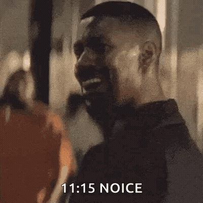 Bearded Man Smiling In Front Of Crowd GIF