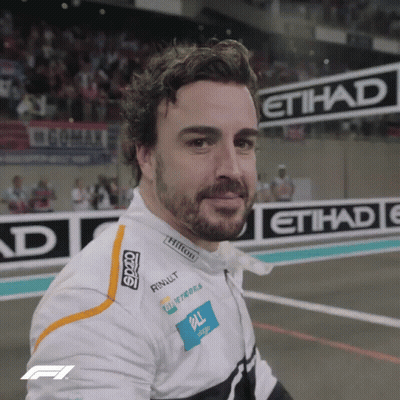 Bearded Man Smiling In Front Of Etihad Sign GIF
