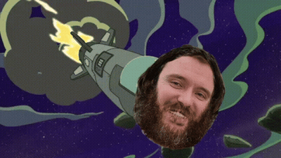 Bearded Man Smiling In Front Of Rocket In Space GIF