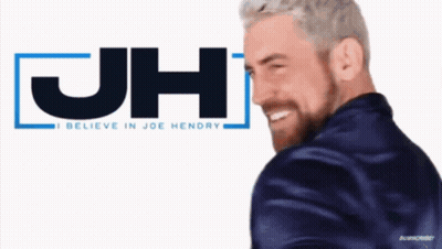 Bearded Man Smiling Near JH Logo GIF