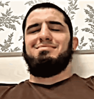 Bearded Man Smiling With Eyes Closed In Brown Shirt GIF