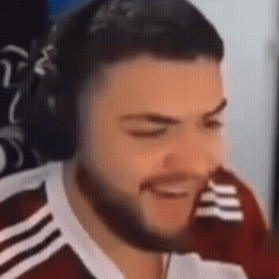 Bearded Man Smiling With Headphones At Computer GIF