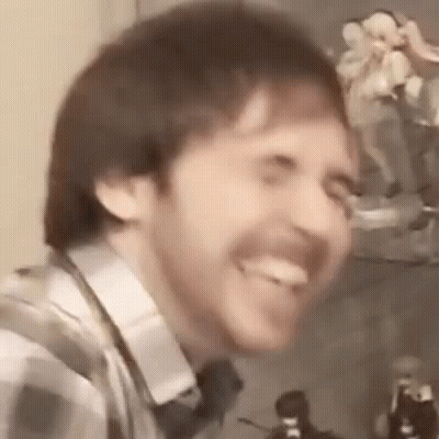 Bearded Man Smiling With Tongue Out GIF