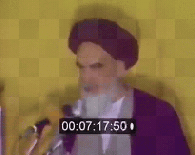 Bearded Man Speaking At Microphone With Timer GIF