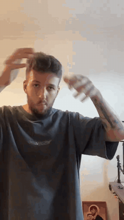 Bearded Man Spraying His Hair GIF