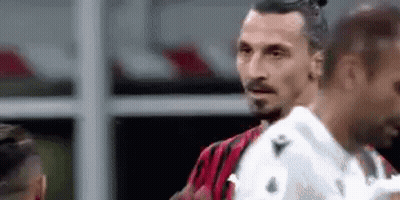 Bearded Man Standing At Microphone Pointing GIF