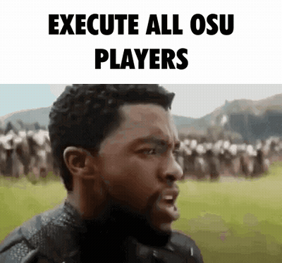 Bearded Man Standing Before Crowd GIF