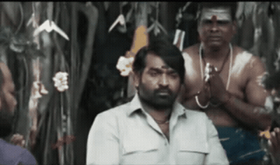 Bearded Man Standing Before Men With Arms Crossed GIF