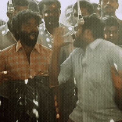 Bearded Man Standing In Crowd GIF