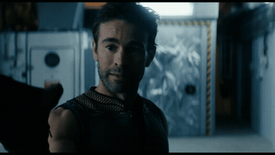 Bearded Man Standing In Dark Room GIF