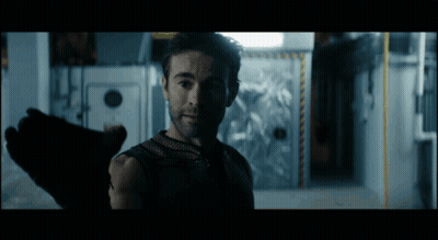 Bearded Man Standing In Dark Room GIF