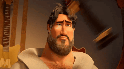 Bearded Man Standing In Front Of Guitar With M GIF