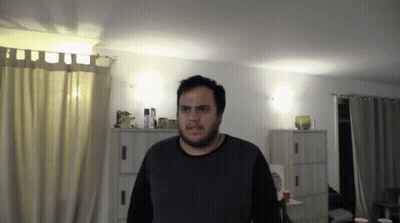 Bearded Man Standing In Living Room GIF