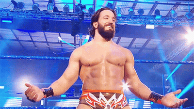 Bearded Man Standing In Wrestling Ring With Arms Outstretched GIF