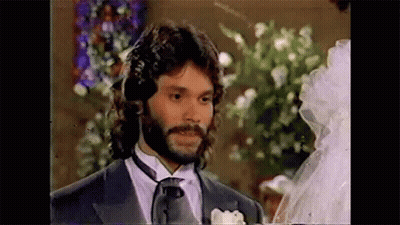 Bearded Man Standing Next To Bride In Wedding Dress GIF