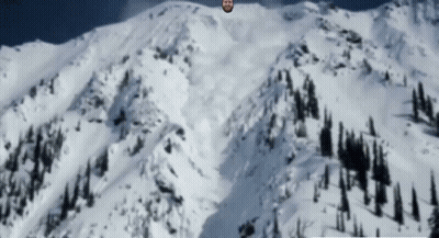 Bearded Man Standing On Snowy Mountain GIF