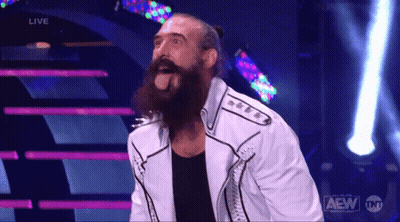 Bearded Man Standing On Stage With AEW Logo GIF