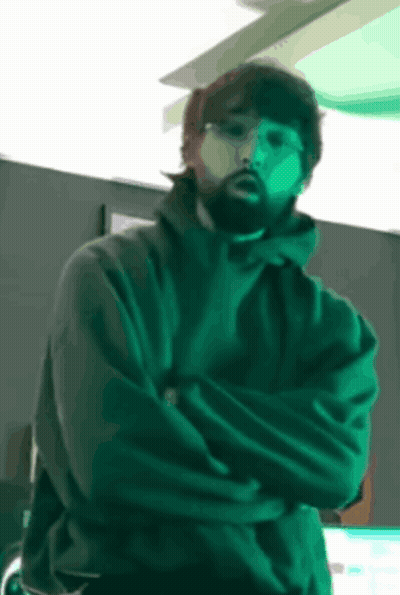 Bearded Man Standing With Crossed Arms GIF