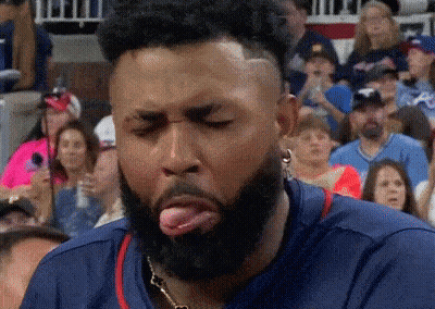Bearded Man Sticking Tongue Out At Crowd GIF